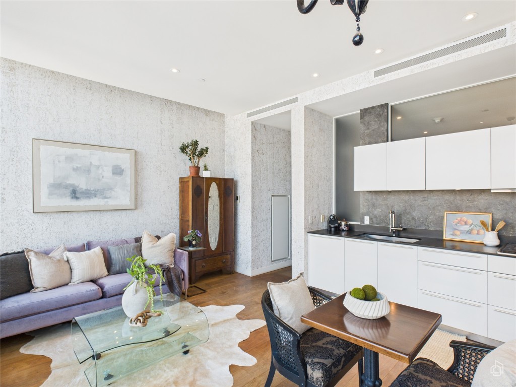 210 Lavaca Street, Unit 1809 Austin, TX 78701 - Photo 17 of 32 Living area with light wood-style flooring, recessed lighting, and wallpapered walls