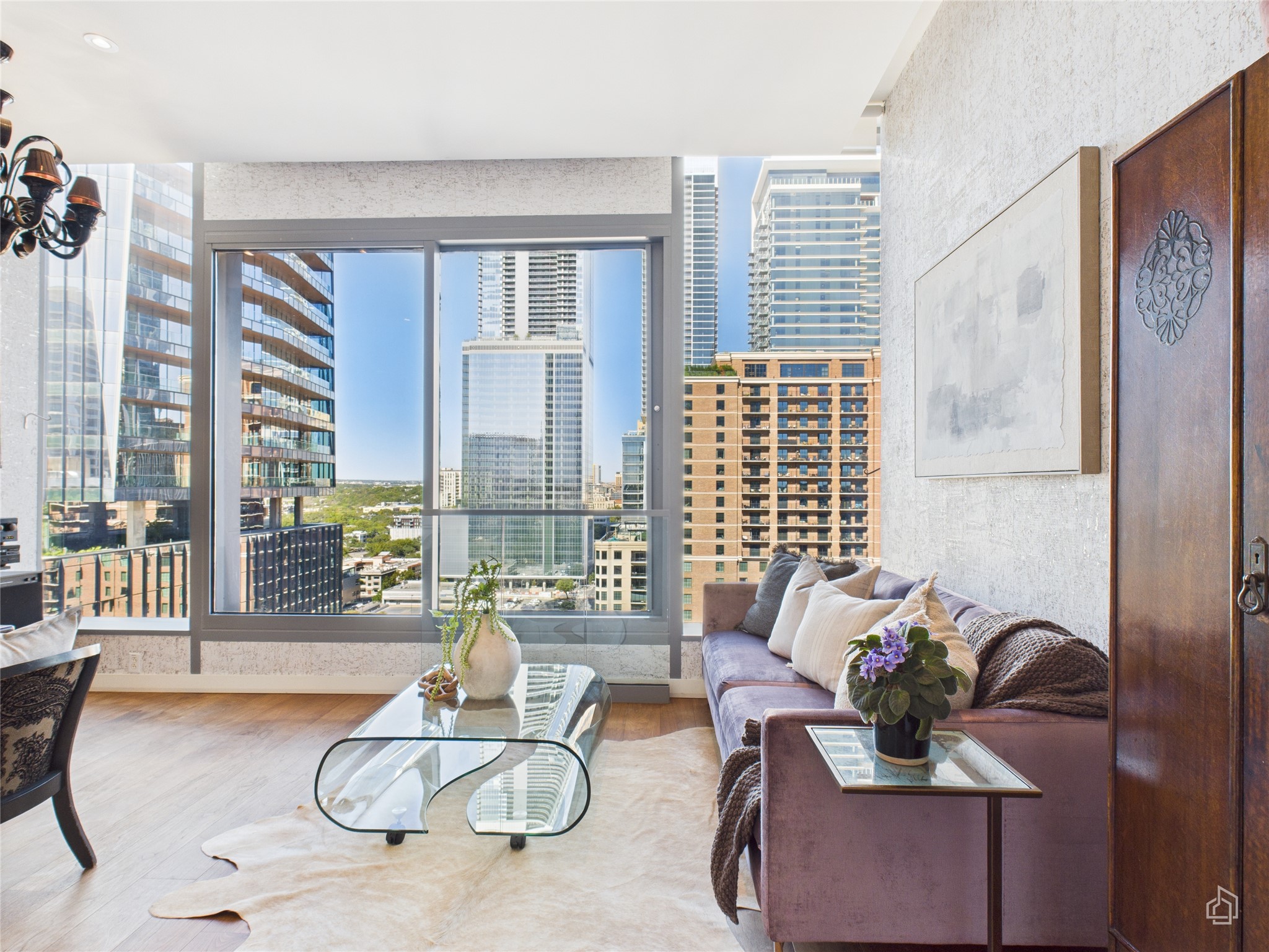 210 Lavaca Street, Unit 1809 Austin, TX 78701 - Photo 19 of 32 a living room with furniture and floor to ceiling windows