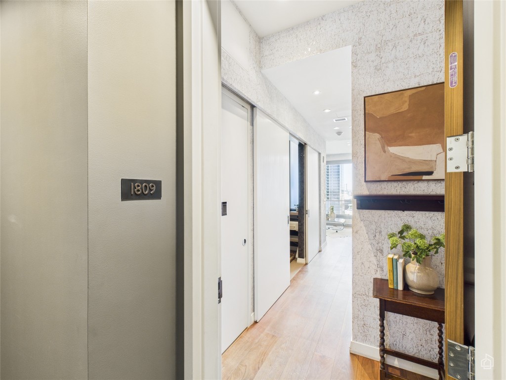 210 Lavaca Street, Unit 1809 Austin, TX 78701 - Photo 2 of 32 Hall with wood finished floors and recessed lighting