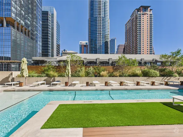 a view of a swimming pool with a lounge chairs