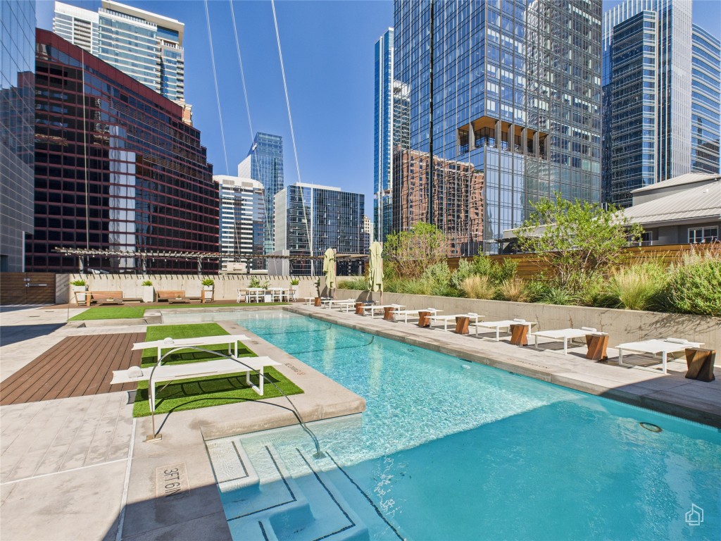 210 Lavaca Street, Unit 1809 Austin, TX 78701 - Photo 23 of 32 Community pool with a view of city and a patio area