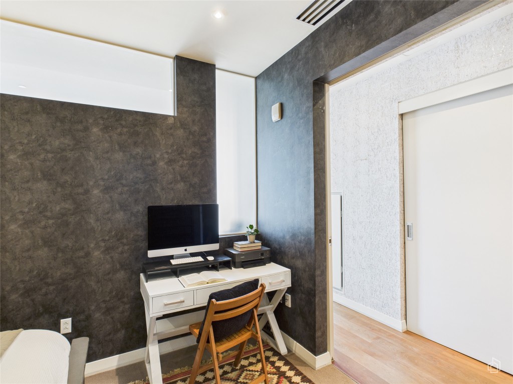210 Lavaca Street, Unit 1809 Austin, TX 78701 - Photo 8 of 32 Office area with light wood finished floors and baseboards