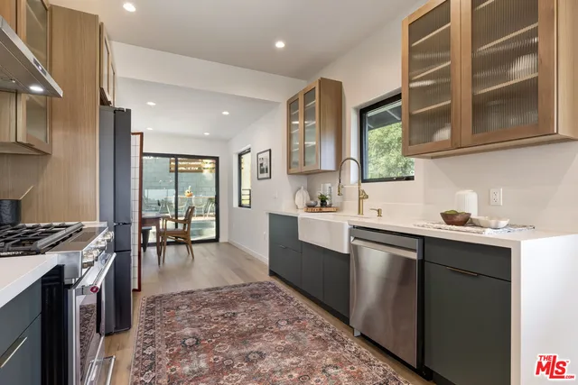 a view of a dining room with furniture and window