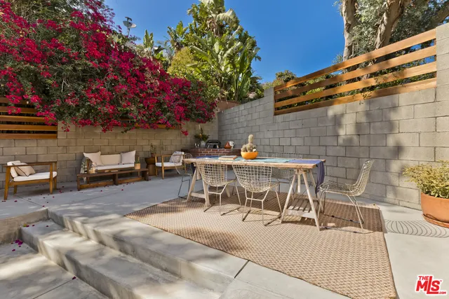 a outdoor space with patio furniture and flowers