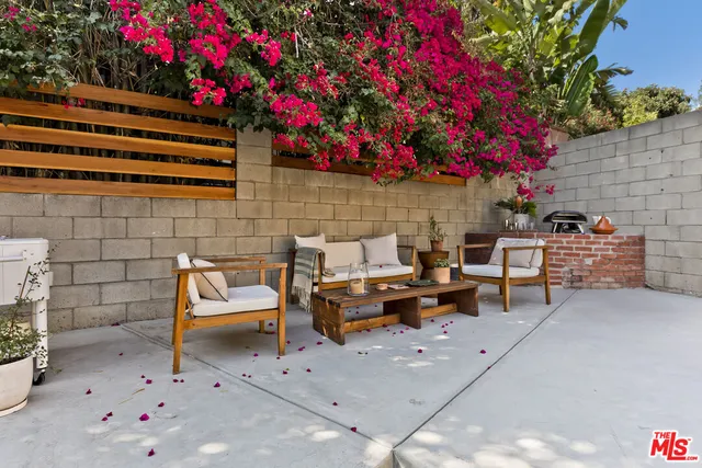 a bedroom with a large bed and a large window