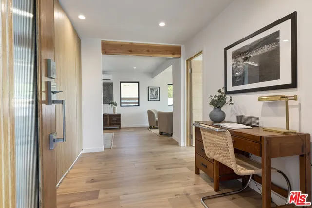 a room with a lot of cabinets and wooden floor