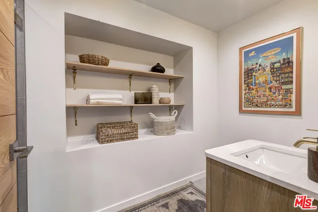 a view of a livingroom with furniture and a potted plant