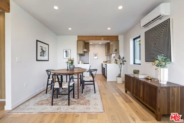 a large kitchen with stainless steel appliances granite countertop a lot of counter space and a sink