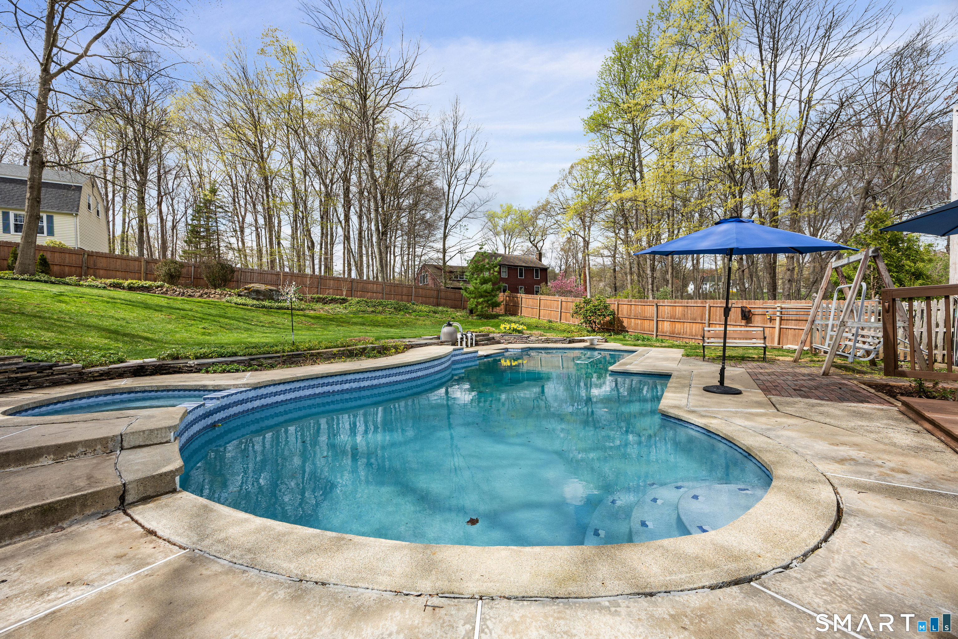 42 Chimney Sweep Road Wallingford, CT 06492 - Photo 7 of 40 a view of a swimming pool with a sitting space