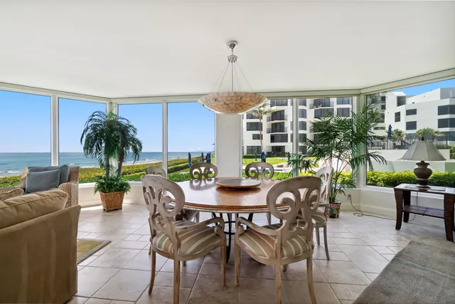 a view of a dining room with furniture window and flowerpot