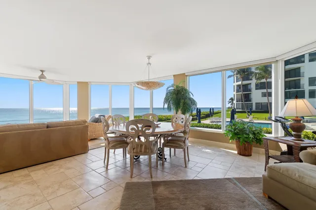a living room with furniture a window and a table