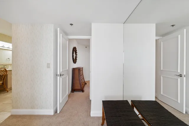 a bedroom with a large bed and a large window