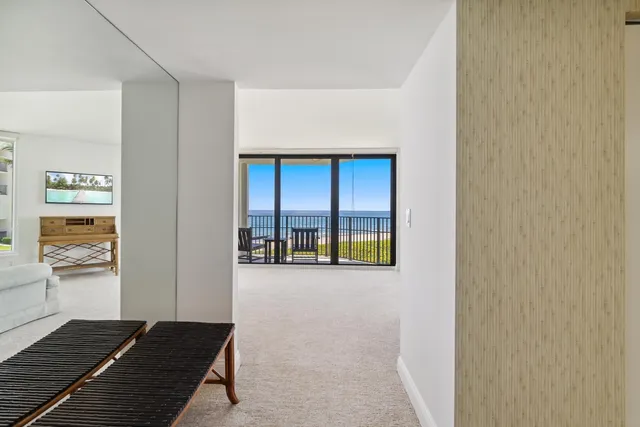 a spacious bedroom with a bed and a couch