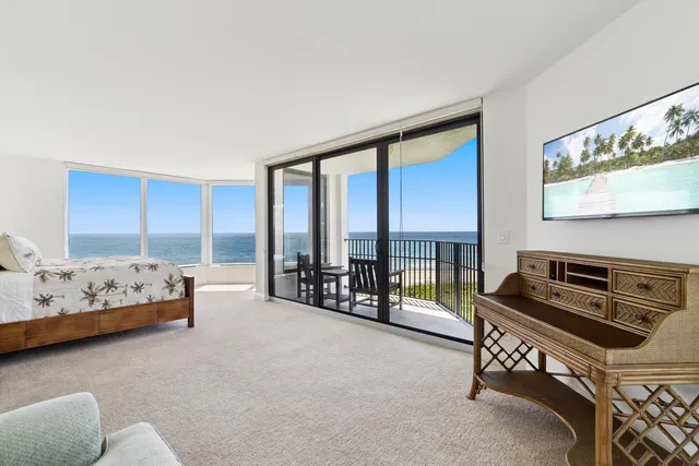 a spacious bedroom with a bed and a cabinets