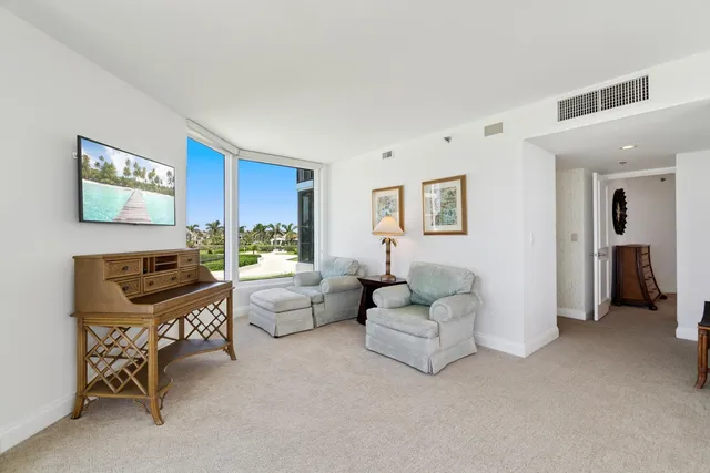 a view of a swimming pool with a patio and a garden