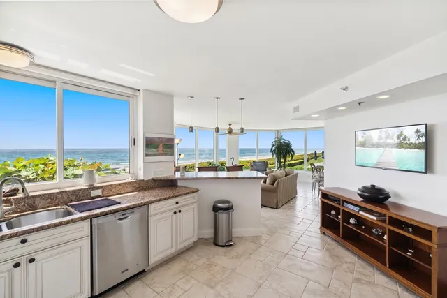 a kitchen with lots of counter top space and appliances