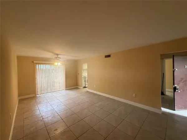 a view of an empty room with a window