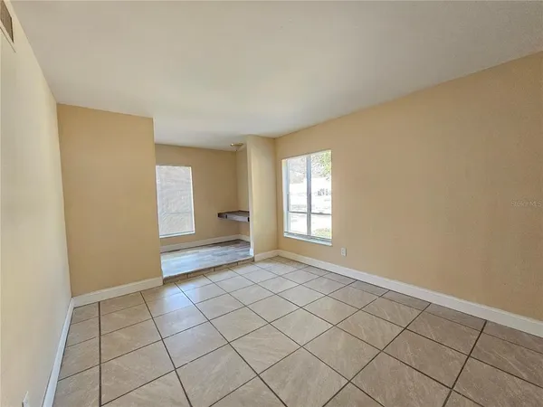 a view of an empty room and window
