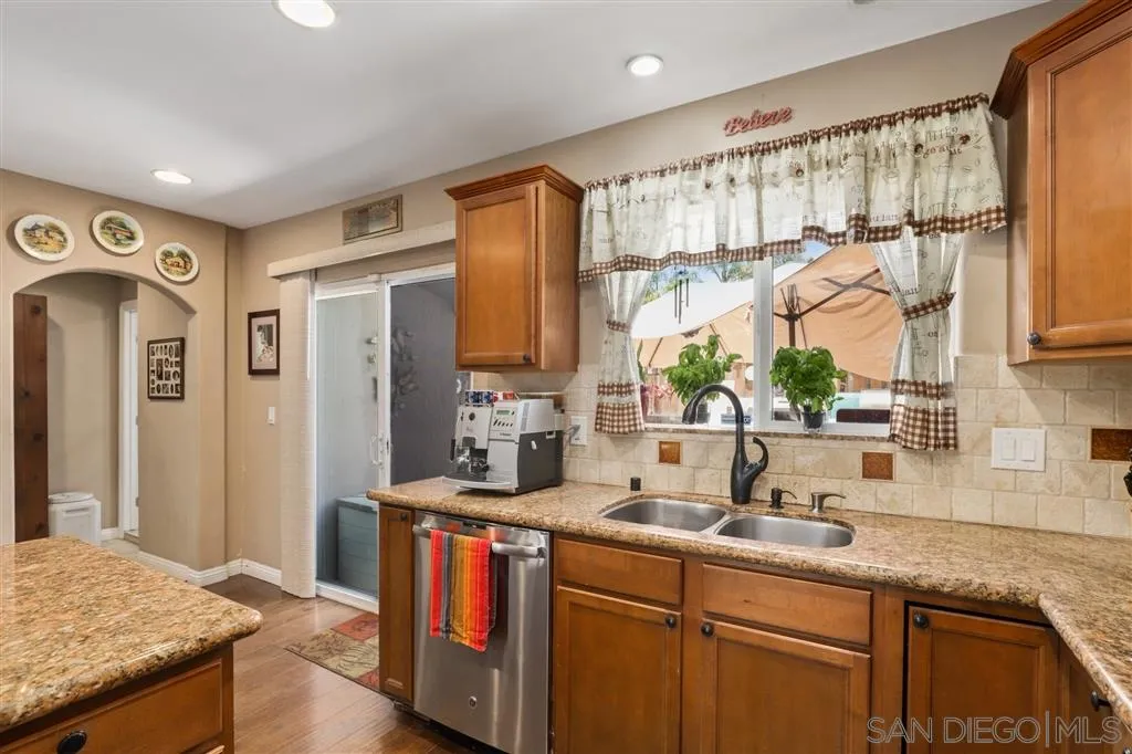 1021 Hillcrest View Lane Fallbrook, CA 92028 - Photo 15 of 24 a kitchen with stainless steel appliances granite countertop a sink and a refrigerator