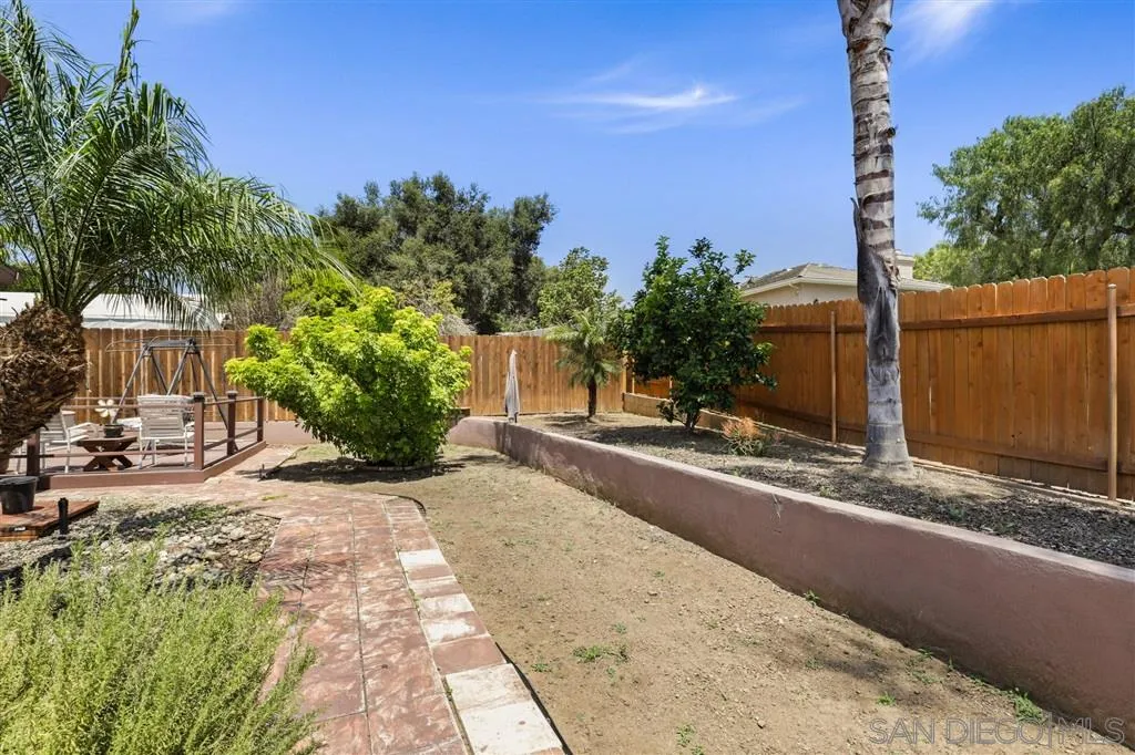1021 Hillcrest View Lane Fallbrook, CA 92028 - Photo 24 of 24 a view of a house with a yard and sitting area
