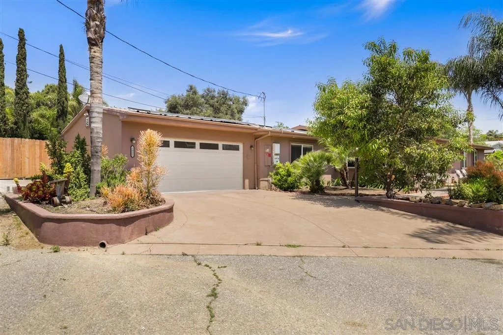 1021 Hillcrest View Lane Fallbrook, CA 92028 - Photo 6 of 24 a front view of a house with a yard