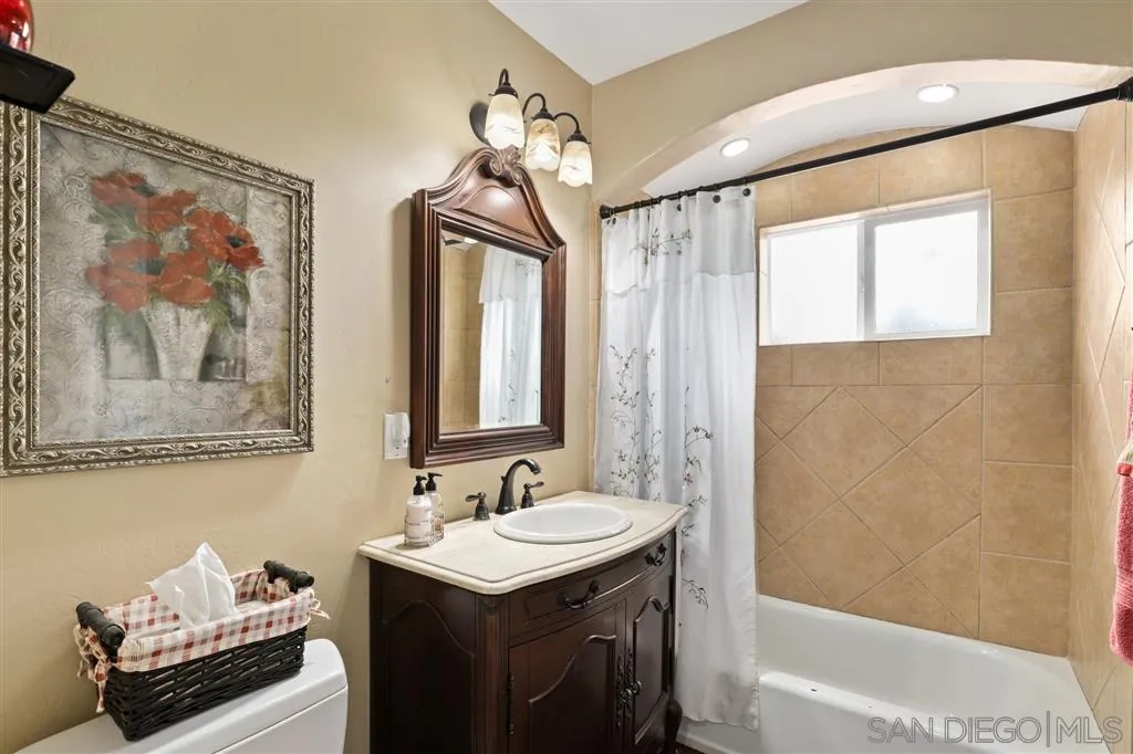 1021 Hillcrest View Lane Fallbrook, CA 92028 - Photo 7 of 24 a bathroom with a sink and a mirror