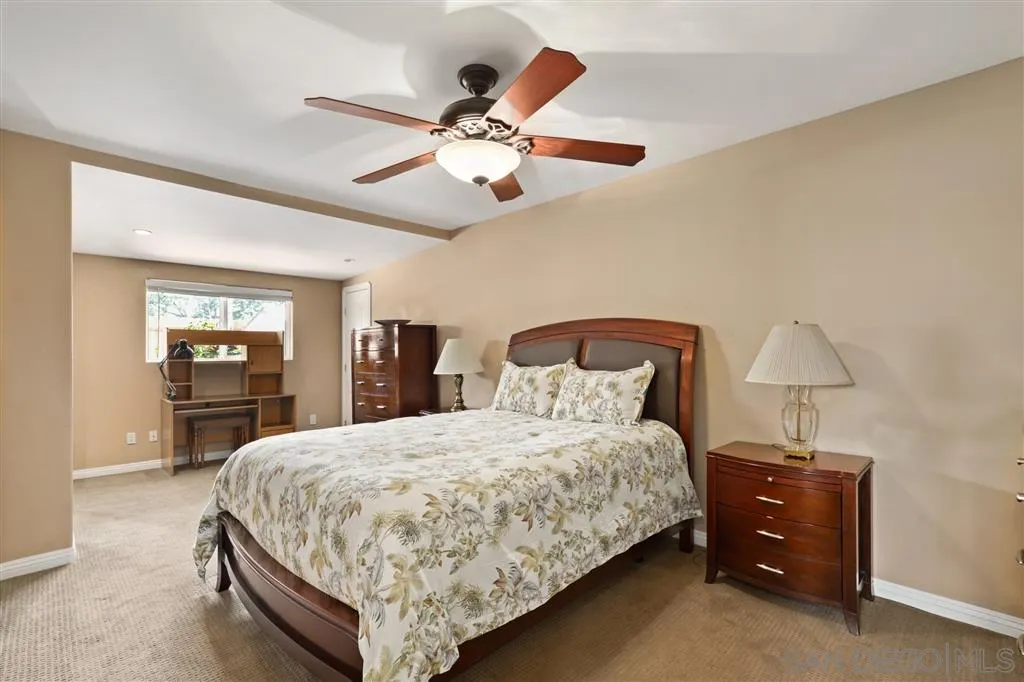 1021 Hillcrest View Lane Fallbrook, CA 92028 - Photo 8 of 24 a bedroom with a bed and closet with lamp