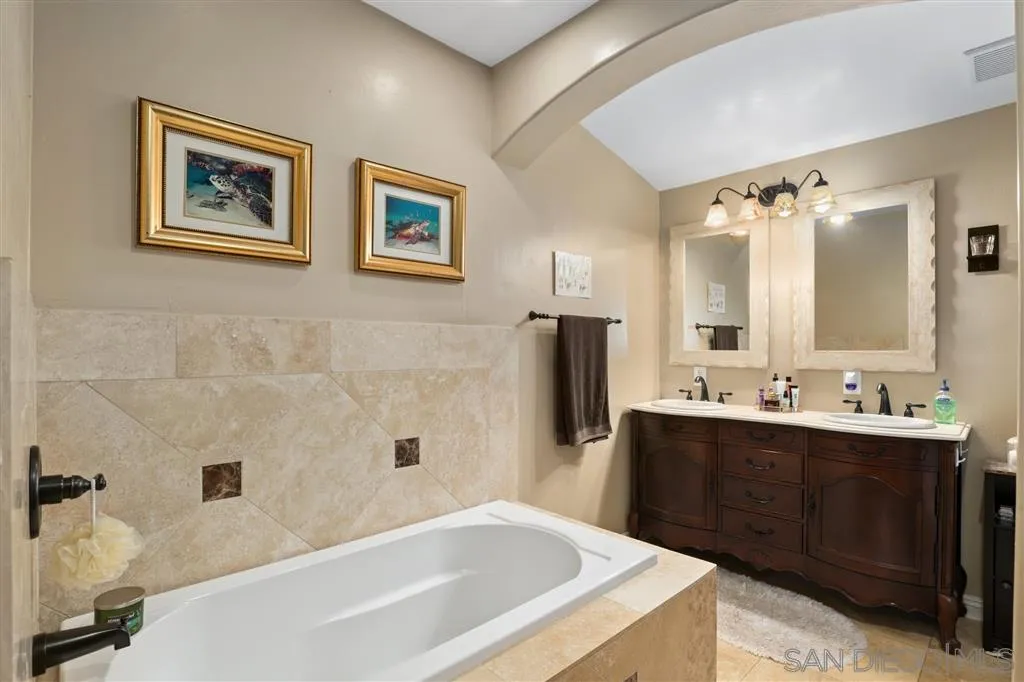 1021 Hillcrest View Lane Fallbrook, CA 92028 - Photo 10 of 24 a bathroom with a tub a sink and mirror