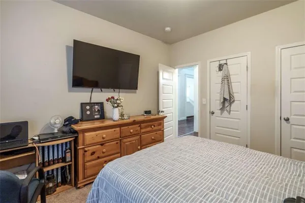 a bathroom with a granite countertop sink and a mirror with toilet