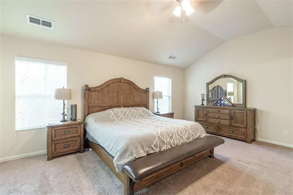 a bedroom with a bed and a cabinets