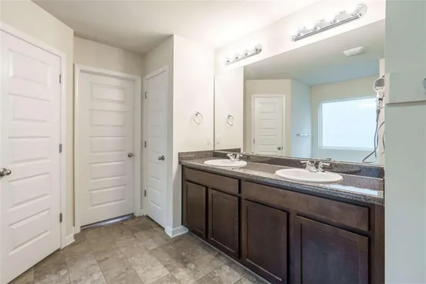 a white bath tub sitting next to a window