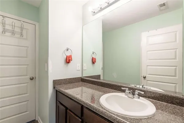 a bathroom with a shower curtain and a sink