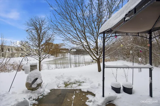 a view of city with snow in front of house
