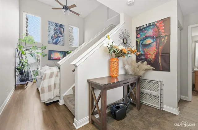 a view of entryway with furniture and wooden floor