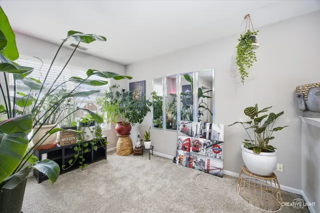 a bedroom with furniture and a flat screen tv