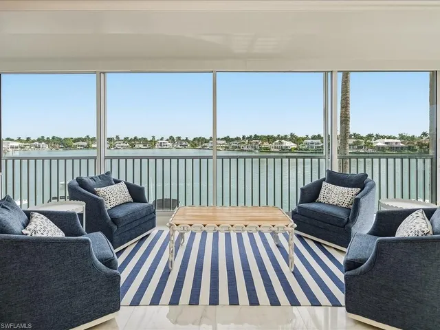 a view of a chair and table on the deck