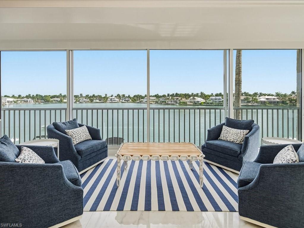 a view of a chair and table on the deck