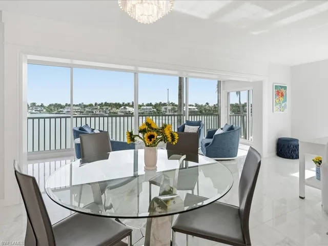 a room with a couch and a view of living room