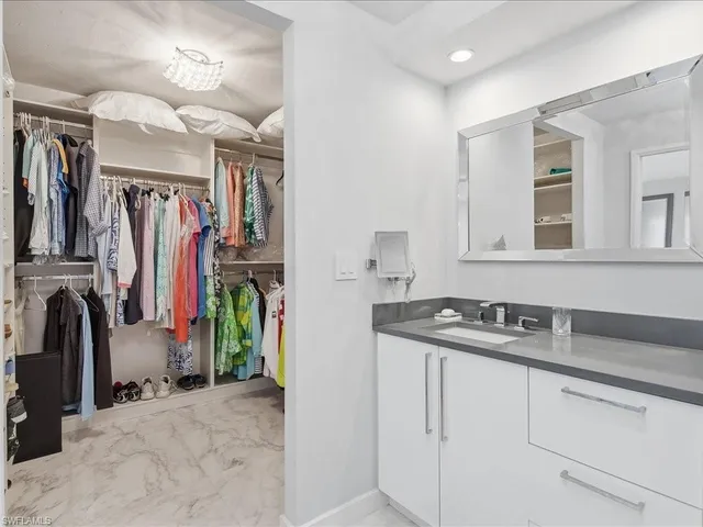 a view of a kitchen with a sink and cabinets