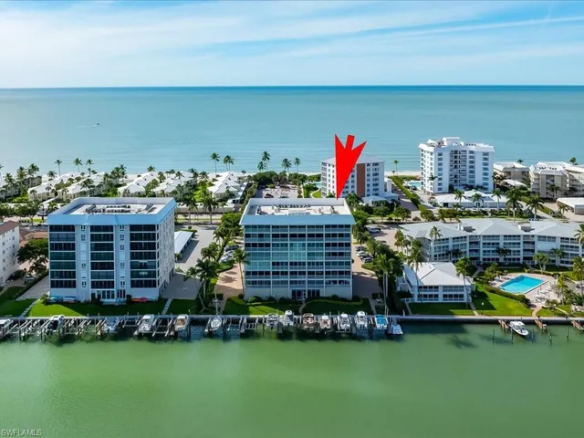 a building with trees in front of it