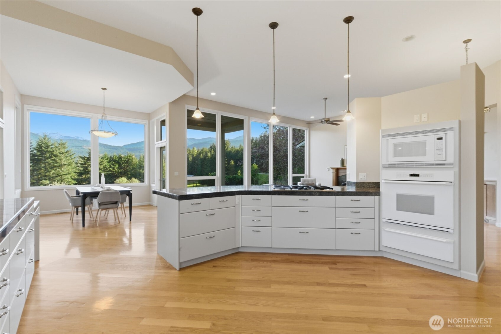 2263 Lost Mountain Road Sequim, WA 98382 - Photo 9 of 40 a large white kitchen with a large window