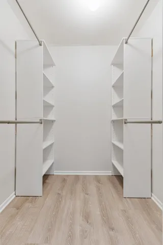 a view of an empty walk in closet