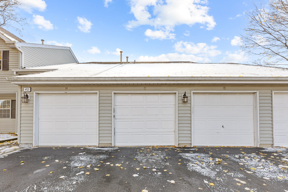 40 South Victoria Lane, Unit G Streamwood, IL 60107 - Photo 21 of 22 a view of a house with a garage