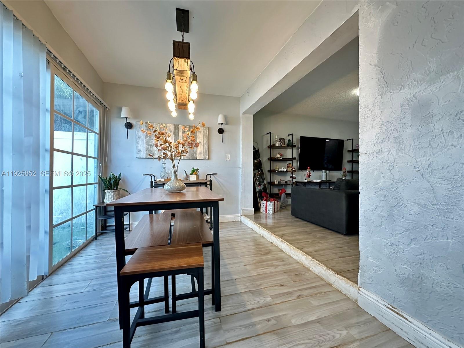 8091 Northwest 12th Street, Unit A Margate, FL 33063 - Photo 12 of 70 a view of a dining room with furniture window and wooden floor