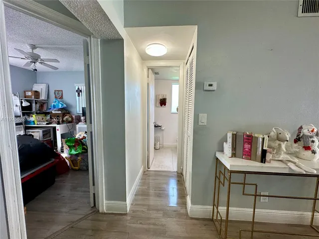 a spacious bedroom with a bed and a large window