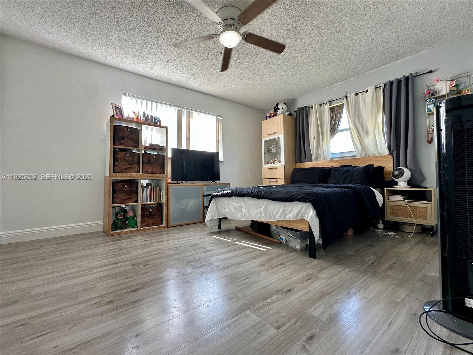 8091 Northwest 12th Street, Unit A Margate, FL 33063 - Photo 29 of 70 a spacious bedroom with a bed and a large window