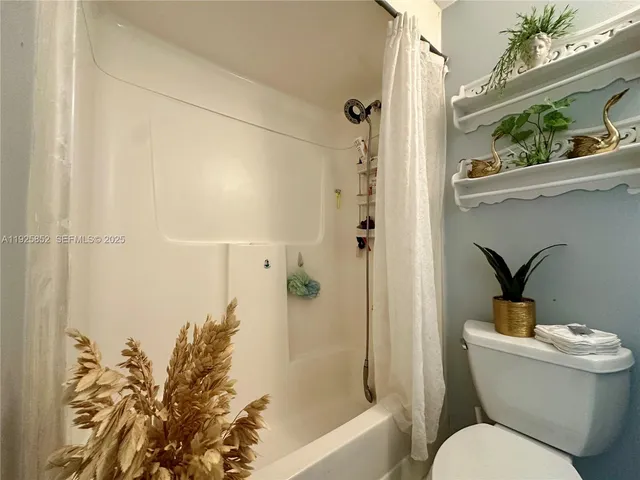 a view of a house with backyard sitting area and garden