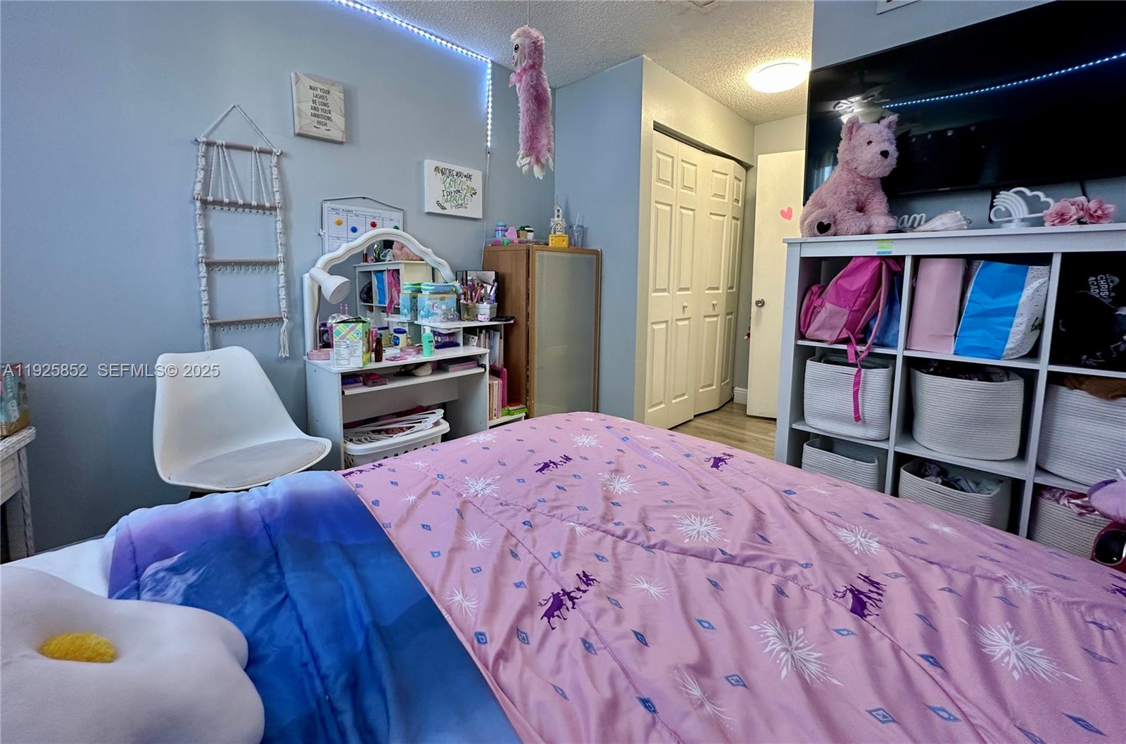 8091 Northwest 12th Street, Unit A Margate, FL 33063 - Photo 39 of 70 a bedroom with furniture and a book shelf