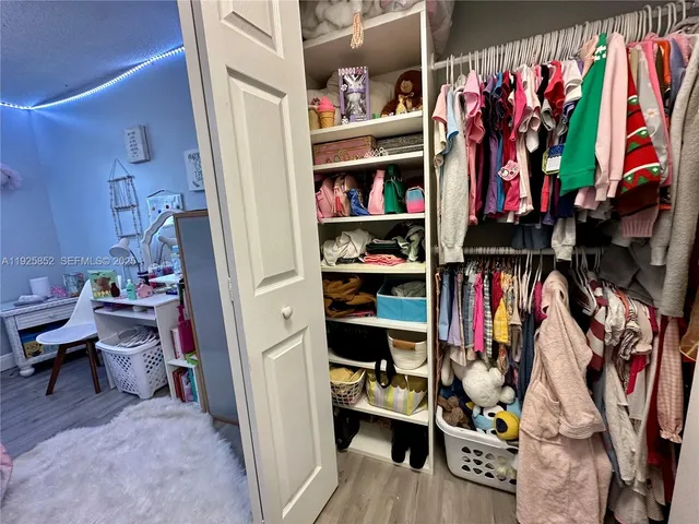 a view of a street with a building in the background