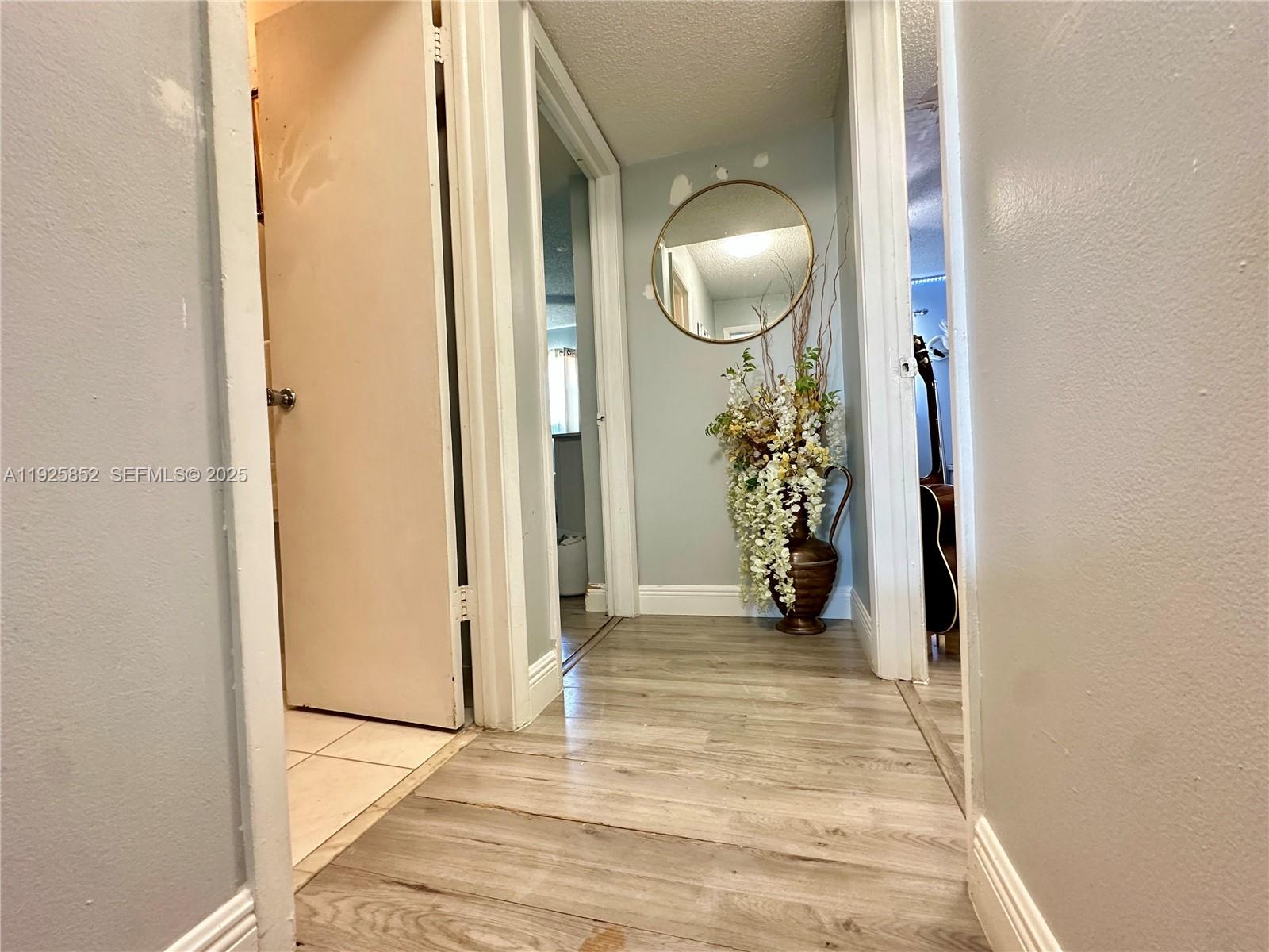 8091 Northwest 12th Street, Unit A Margate, FL 33063 - Photo 42 of 70 a view of a livingroom to closet and a mirror